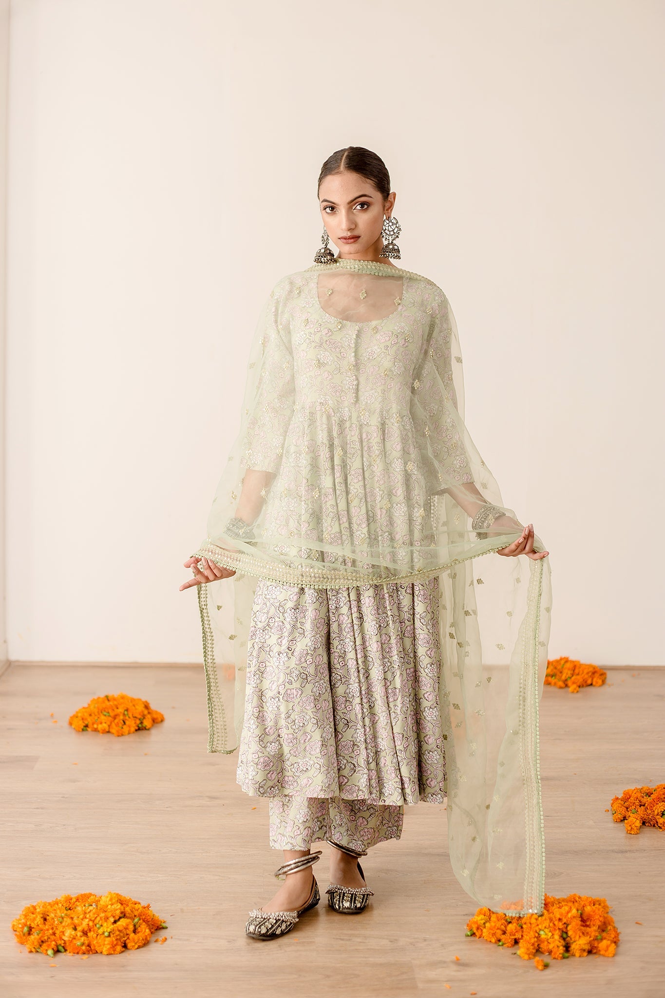 Roshan Peach Anarkali Set- The Soft Colors of this garment will elate you  mood.